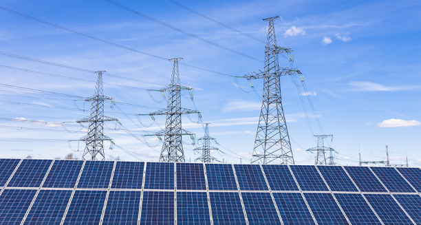Utility transmission lines and solar panels.